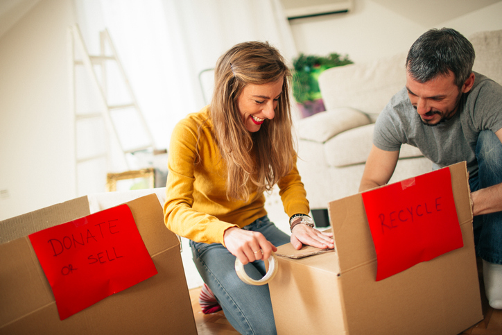 A couple cleans and organizes their home.