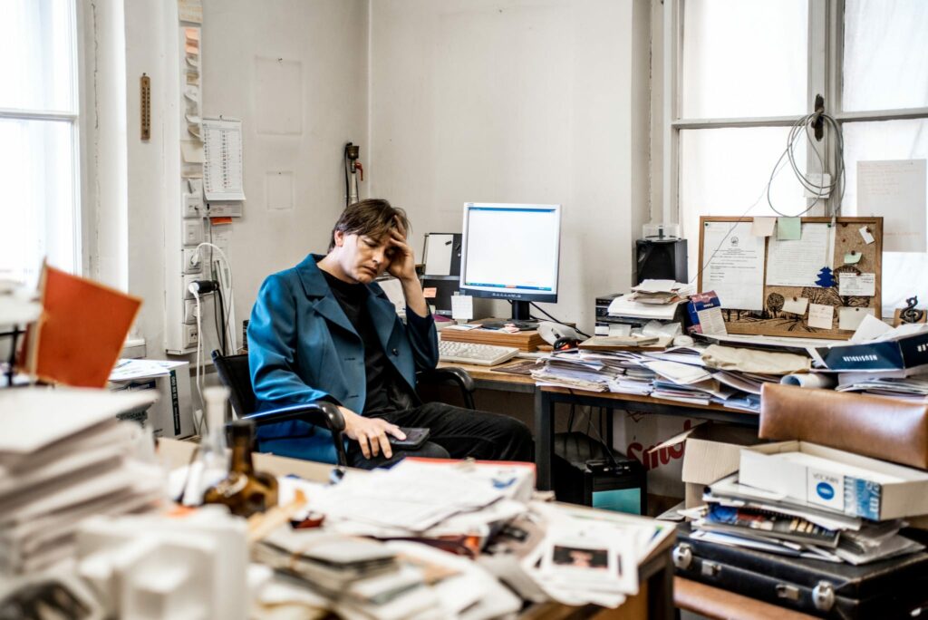 A discouraged business owner can't keep all his inventory paperwork and important files straight.