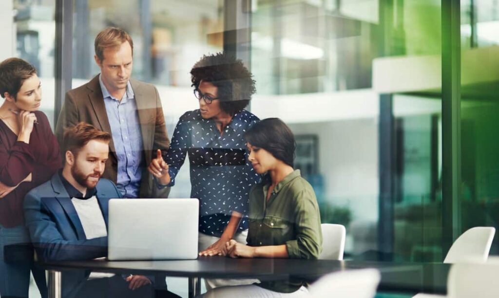 Employees participating in a demand forecasting meeting. 