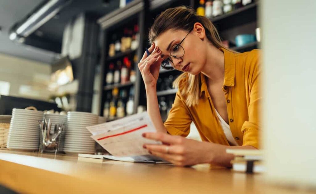A woman reviews invoice payment terms at her job