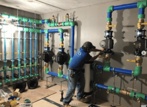 Bilo employees work on an equipment room.